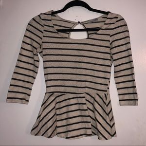 Black and cream-colored striped peplum top.